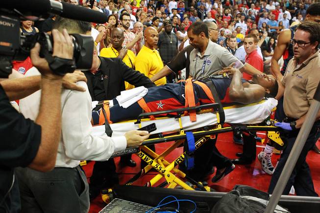 Paul George is wheeled out after fracturing his leg during the 2014 USA Basketball Showcase Friday, Aug. 1, 2014 at the Thomas & Mack Center.