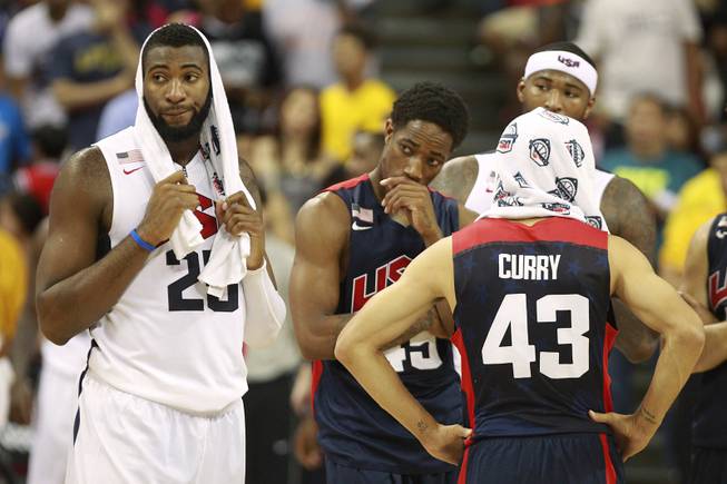 Teammates react after Paul George fractured his leg during the 2014 USA Basketball Showcase Friday, Aug. 1, 2014 at the Thomas & Mack Center.