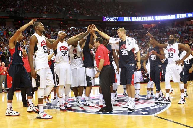 The 2014 USA Basketball team huddle after calling off their game as a result of Paul George fracturing his leg  Friday, Aug. 1, 2014 at the Thomas & Mack Center.