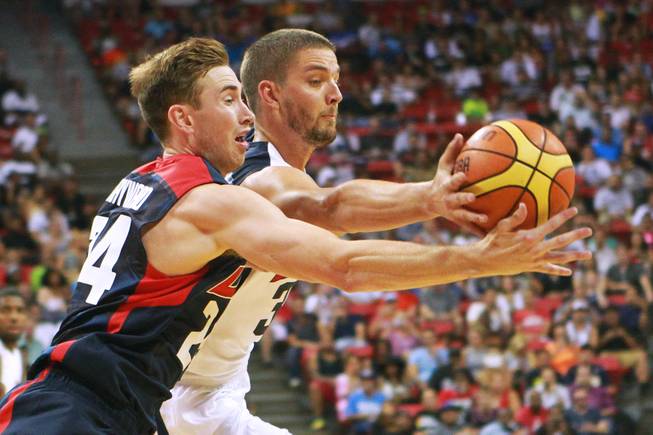 Gordon Hayward, left, and Chandler Parsons chase a rebound during the 2014 USA Basketball Showcase Friday, Aug. 1, 2014 at the Thomas & Mack Center.