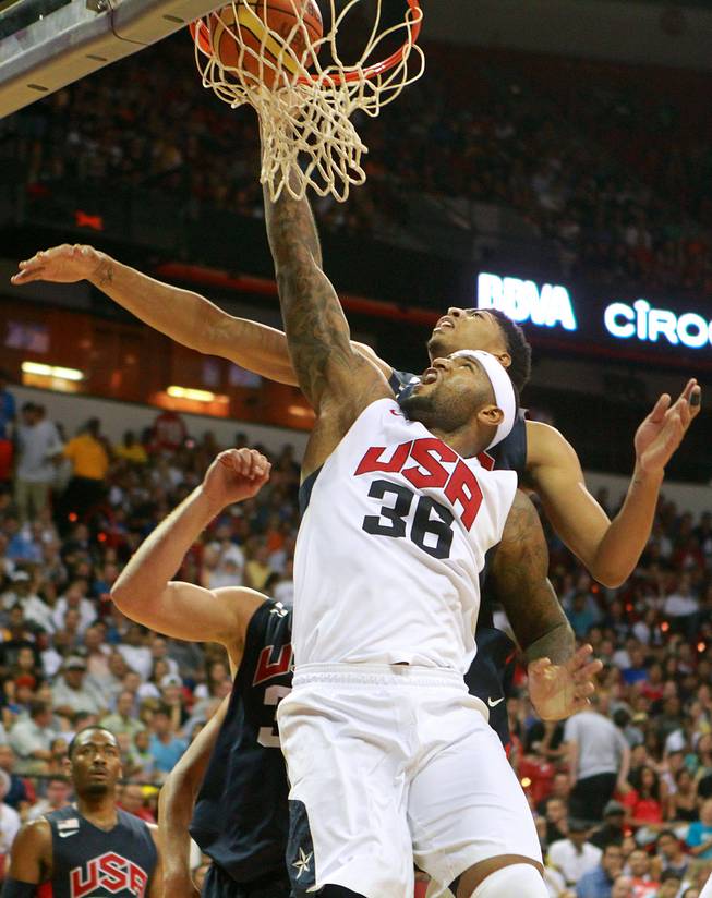 DeMarcus Cousins dunks on Anthony Davis during the 2014 USA Basketball Showcase Friday, Aug. 1, 2014 at the Thomas & Mack Center.