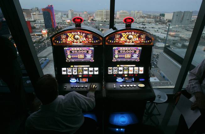 In this June 6, 2007, file photo, Bally Technologies slot machines are showcased at the Palms hotel-casino in Las Vegas.