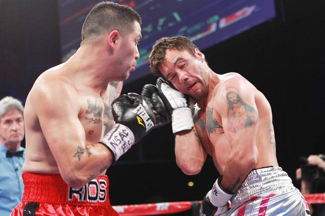 Diego Chaves blocks a left from Brandon Rios during their welterweight fight Saturday, Aug. 2, 2014 at the Cosmopolitan. Rios won after Chaves was disqualified in the ninth round.