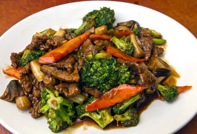 Beef and Broccoli dish by Chef Ivo Karkaliev now cooking Chinese food for the Cafe Fiesta at Fiesta Henderson on Monday, July 28, 2014.   L.E. Baskow