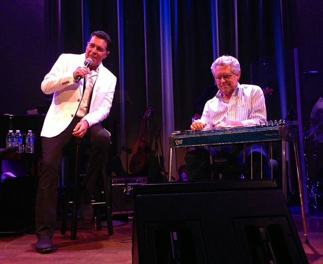 Clint Holmes, left, performs with slide-guitar artist Joel Ferguson at Cabaret Jazz at the Smith Center on Sunday, Aug. 3, 2014.
