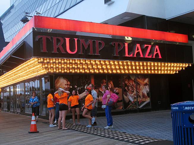 This July 24, 2014, photo shows several lights burned out in the illuminated facade of the Trump Plaza Hotel Casino in Atlantic City, Tuesday Aug. 5, 2014.