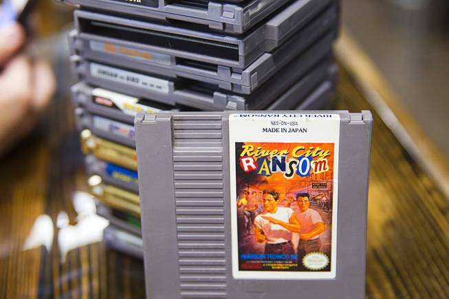 Classic Nintendo games are stacked on a counter at Bad Beat Brewing, 7380 Eastgate Rd., a brewery in Henderson's "Booze District," Thursday, August 7, 2014.