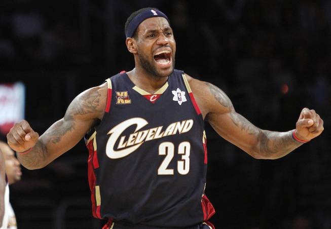 In this Dec. 25, 2009, file photo, Cleveland Cavaliers forward LeBron James reacts during the second half against the Los Angeles Lakers in an NBA game in Los Angeles.