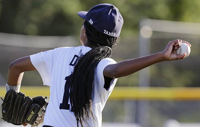 In this Aug. 6, 2014, photo, Pennsylvania pitcher Mo'Ne Davis follows through on a throw prior to facing the District of Columbia in the Little League Eastern Regionals at Breen Stadium in Bristol, Conn.