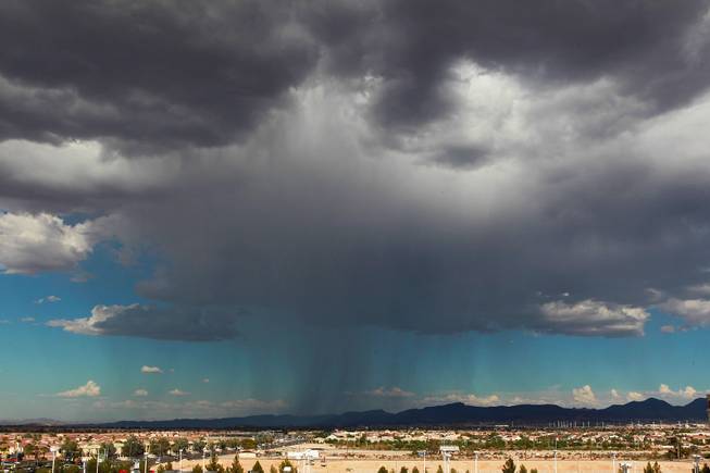 Rain is seen falling in the Henderson area Saturday, Aug. 9, 2014.