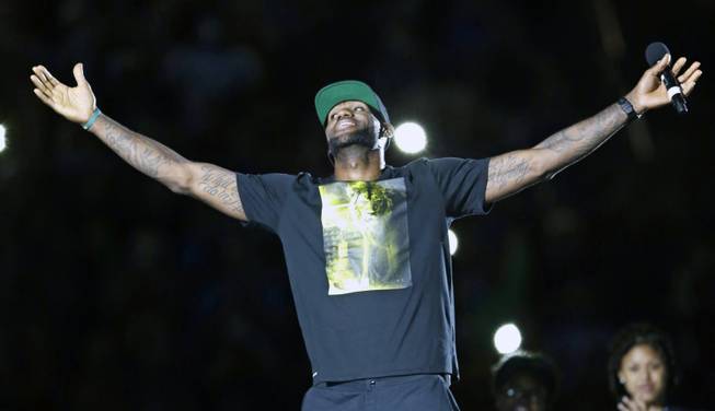 Cleveland Cavaliers' LeBron James smiles as he is introduced at his homecoming at InfoCision Stadium Friday, Aug. 8, 2014, in Akron, Ohio.