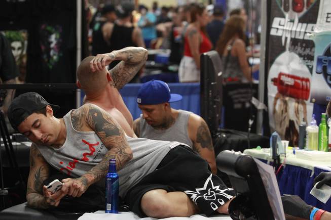 Tattoo artists and aficionados take part in the 3rd annual Art-N-Ink Tattoo Festival Saturday, Aug. 9, 2014 at the South Point.