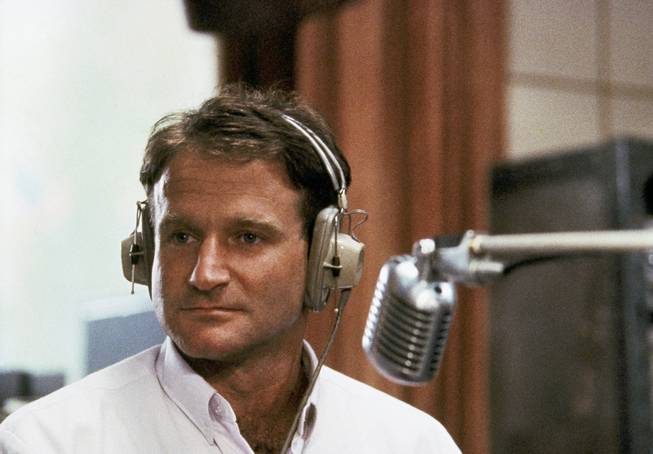 This 1987 file photo shows actor Robin Williams in character as disc jockey Adrian Cronauer in director Barry Levinson's comedy drama "Good Morning Vietnam." Williams has died in an apparent suicide. He was 63.