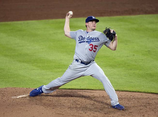 Los Angeles Dodgers pitcher Kevin Correia works in the sixth inning of a baseball game against the Atlanta Braves Monday, Aug. 11, 2014 in Atlanta.