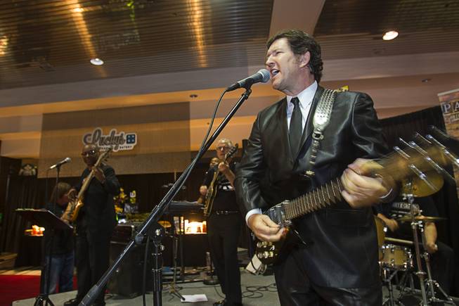 Paul Casey and the Abbey Road Crossing band perform during a news conference in the lobby of the Las Vegas Convention Center Tuesday, Aug. 12, 2014. The event celebrated the 50th anniversary of the Beatles concert in Las Vegas on August 20, 1964. A multi-media exhibition commemorating the event will be on display in the lobby of the LVCC through Oct. 27.
