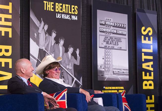Rossi Ralenkotter, left, president/CEO of the Las Vegas Convention and Visitors Authority (LVCVA), and Clark County Commissioner Tom Collins attend a news conference in the lobby of the Las Vegas Convention Center Tuesday, Aug. 12, 2014. The event celebrated the 50th anniversary of the Beatles concert in Las Vegas on August 20, 1964. A multi-media exhibition commemorating the event will be on display in the lobby of the LVCC through Oct. 27.