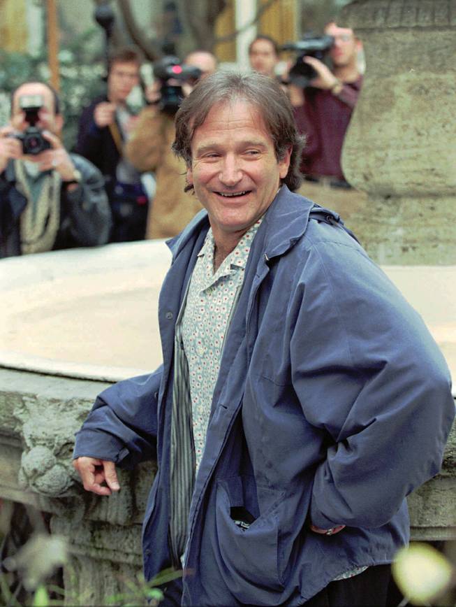 Actor-comedian Robin Williams poses for the photographers in the backyard of a hotel in Hamburg, Germany, on Friday, April 19, 1996. Williams, well known for his movies "Mrs. Doubtfire", "Hook", "Dead Poets Society",  "Good Morning Vietnam" and more recently "Jumanji", is promoting  his new picture "Birdcage."