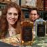 Jessica Rosman and Arturo Palencia of Skere Spirits are seen with the three different mezcals their company produces Friday, Aug. 8, 2014.