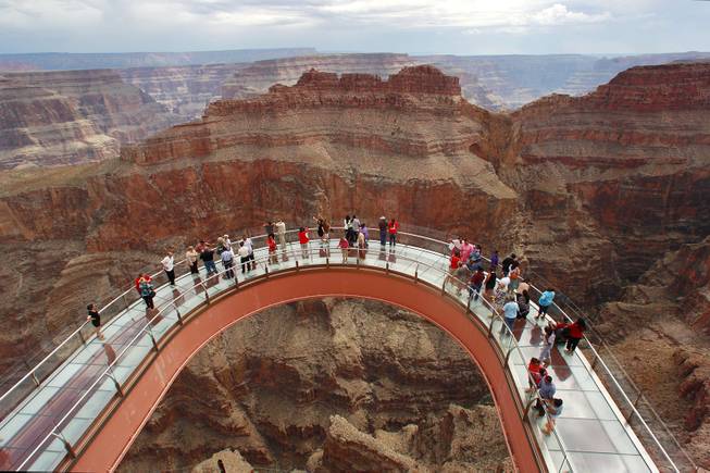 Visitors use the Skywalk at Grand Canyon West Tuesday, Aug. 12, 2014.