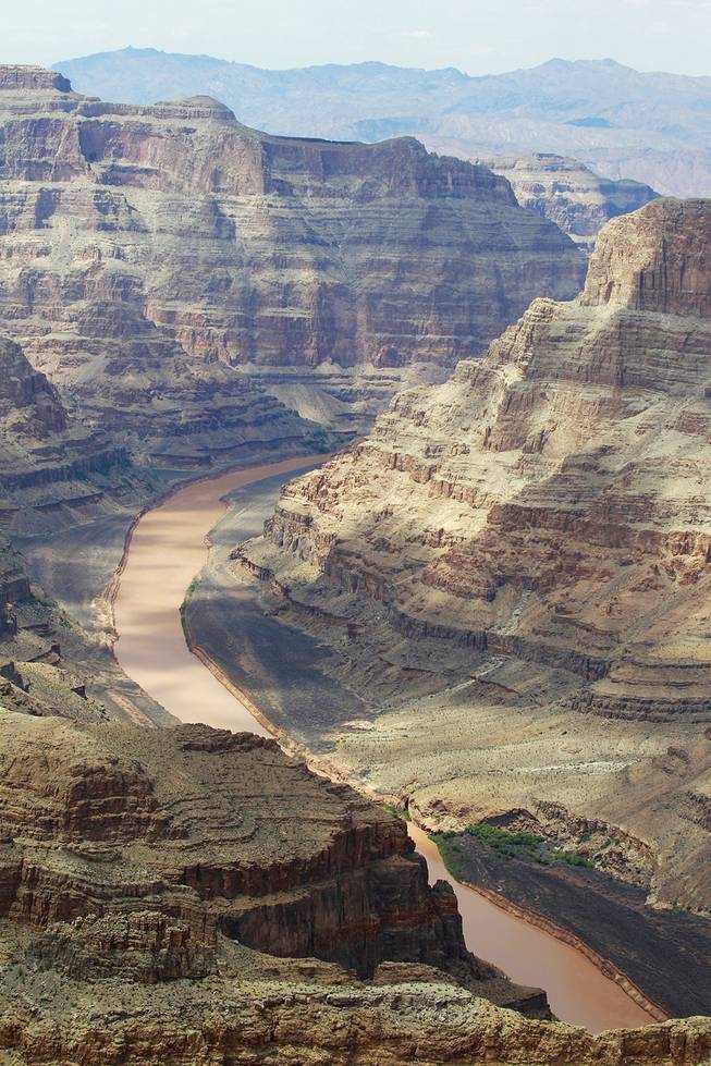 The Colorado River runs through the Grand Canyon at Grand Canyon West Tuesday, Aug. 12, 2014.