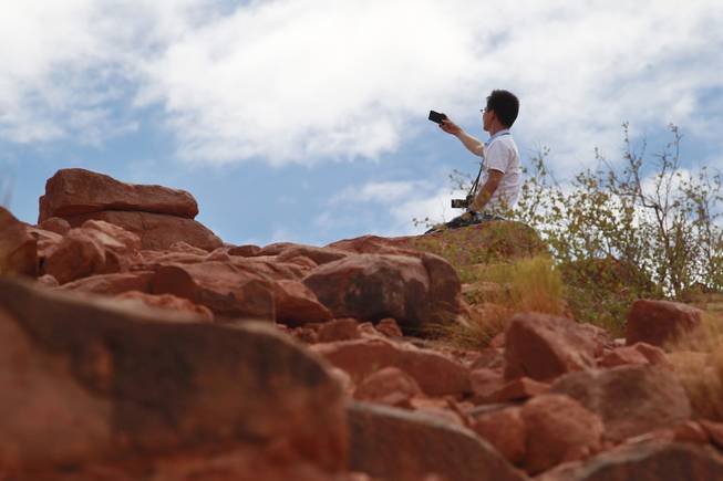 A tourist takes a self portrait at Grand Canyon West Tuesday, Aug. 12, 2014.