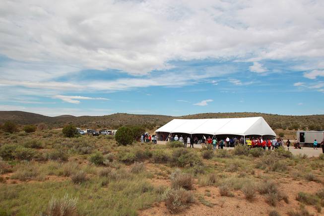 Hualapai tribe members and guests gather for the official opening of the newly paved section of Diamond Bar Road leading to Grand Canyon West Tuesday, Tuesday, Aug. 12, 2014.