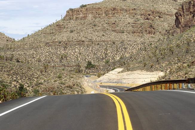 The newly paved section of Diamond Bar Road leads to Grand Canyon West Tuesday, Tuesday, Aug. 12, 2014.
