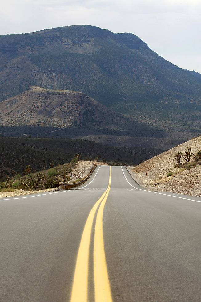 A section of the newly paved section of Diamond Bar Road heads away from Grand Canyon West Tuesday, Tuesday, Aug. 12, 2014.