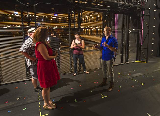 Head carpenter Jamie Kurtz, right, stands between two video walls during a backstage tour of "Ghost The Musical" at the Smith Center for the Performing Arts Wednesday Aug. 13, 2014. The musical runs through Sunday, Aug. 17.