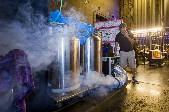 Brandi Fucci tests a fog machine during a backstage tour of "Ghost The Musical" at the Smith Center for the Performing Arts Wednesday Aug. 13, 2014. The production uses four foggers and four hazers. The musical runs through Sunday, Aug. 17.
