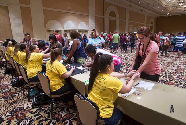 Teachers sign in to pick up free school supplies during MGM Resorts annual Educator Appreciation Day at the Mirage Thursday Aug. 14, 2014. In addition to school supplies provided by MGM Resort employees, a variety of agencies participated in the days activities to introduce educators to teaching resources available in the community.