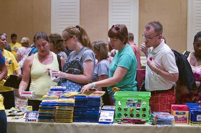 Teachers pick up free school supplies during MGM Resorts annual Educator Appreciation Day at the Mirage Thursday Aug. 14, 2014. In addition to school supplies provided by MGM Resort employees, a variety of agencies participated in the days activities to introduce educators to teaching resources available in the community.