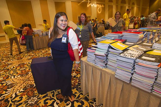 Jennifer Yupangco, a kindergarten teacher at Dearing Elementary School, uses a rolling suitcase to carry free school supplies during MGM Resorts annual Educator Appreciation Day at the Mirage Thursday Aug. 14, 2014. In addition to school supplies provided by MGM Resort employees, a variety of agencies participated in the days activities to introduce educators to teaching resources available in the community.
