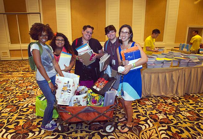 Ebonee Coe, left, and other Park Elementary School teachers, pose with a wagon load of school supplies during MGM Resorts annual Educator Appreciation Day at the Mirage Thursday Aug. 14, 2014. In addition to school supplies provided by MGM Resort employees, a variety of agencies participated in the days activities to introduce educators to teaching resources available in the community.