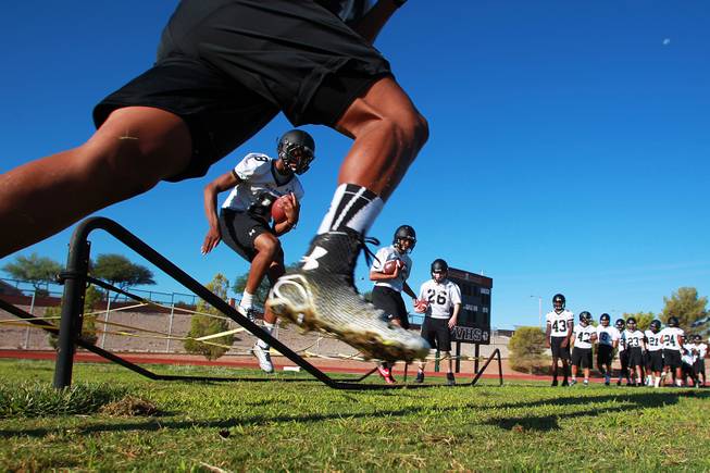 Palo Verde football players run a drill during their first official practice day Thursday, Aug. 14, 2014.