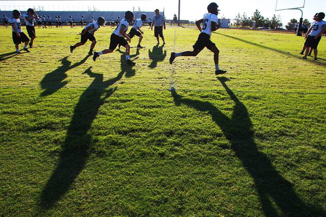 Palo Verde football players run a drill during their first official practice day Thursday, Aug. 14, 2014.
