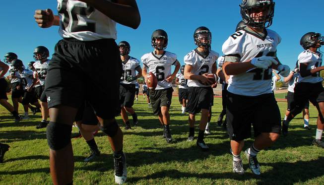 Palo Verde football players head for a water break during their first official practice day Thursday, Aug. 14, 2014.