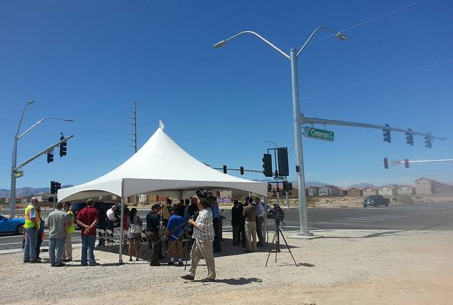 State leaders officially welcomed a new traffic light and crosswalk at Blue Diamond and Cimarron roads, Thursday, Aug. 14, 2014.