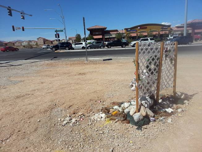 When Helen Liu was killed in November, there was no crosswalk at Blue Diamond and Cimarron roads. A memorial is seen at the intersection, which also now features a new crosswalk and traffic light, Thursday, Aug. 14, 2014.
