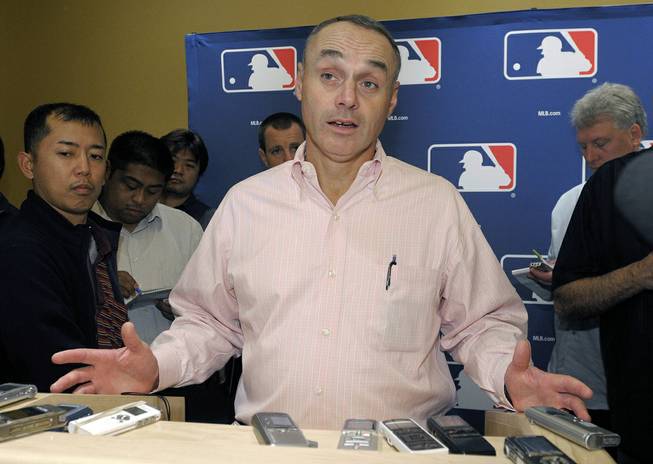 In this Nov. 16, 2010 file photo, Rob Manfred, Major League Baseball executive vice president for labor relations, talks to reporters during the meeting of baseball's general managers in Lake Buena Vista, Fla. Rob Manfred has been elected baseball's 10th commissioner, Thursday, Aug. 14, 2014, and will succeed Bud Selig in January.