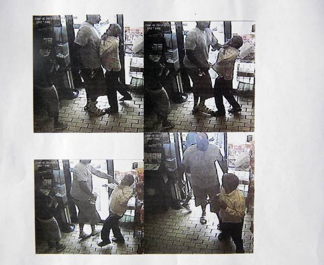 These images provided by the Ferguson Police Department show security camera footage from a convenience store in Ferguson, Mo., on Aug. 9, 2014, the day that Michael Brown was fatally shot by a police officer. A report released Friday, Aug. 15, 2014, by Ferguson Police Chief Thomas Jackson says the footage shows a confrontation between Brown and an employee at the store. The report says that Brown and his friend, Dorian Johnson, stole a box of cigars from the store shortly before Brown's death.