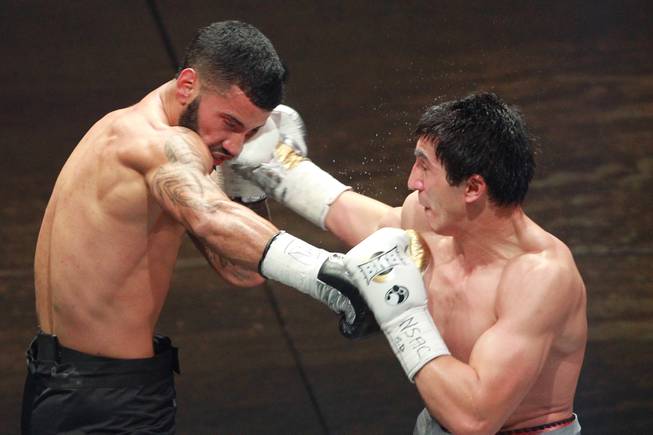 Khurshid Abdullaev hits Ricardo Pinell with a right during their fight on the inaugural card of Big Knockout Boxing Saturday, Aug. 16, 2014 at the Mandalay Bay Events Center. Abdullaev won by unanimous decision.