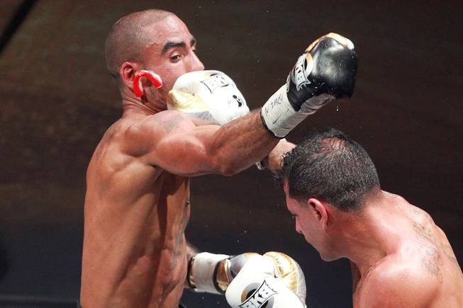 David Estrada knocks the mouthguard out of Eddie Caminero during their fight on the inaugural card of Big Knockout Boxing Saturday, Aug. 16, 2014 at the Mandalay Bay Events Center. Estrada won by unanimous decision.