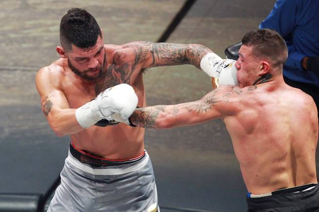 Gabe Rosado gets hit by Bryan Vera during their fight on the inaugural card of Big Knockout Boxing Saturday, Aug. 16, 2014 at the Mandalay Bay Events Center. Rosado won by TKO.