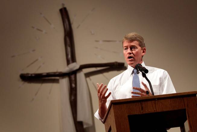 Missouri Attorney General Chris Koster, right, speaks at the Greater St. Mark Family Church in Ferguson, Mo. on Sunday Aug. 17, 2014. "A member of your community died at the hands of a member of my community," Koster said. "Not just the caucasian community but the law enforcement community." On Saturday, Aug. 9, 2014, a white police officer fatally shot Michael Brown, an unarmed black teenager, in the St. Louis suburb. 