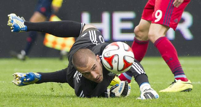 Montreal Impact goalkeeper Evan Bush keeps his eyes on the ball as Chicago Fire's Mike Magee (9) moves in during the first half of a Major League Soccer game Saturday, Aug. 16, 2014, in Montreal. Findlay Sports and Entertainment is proposing building a stadium and bringing an MLS franchise to Symphony Park in downtown Las Vegas.