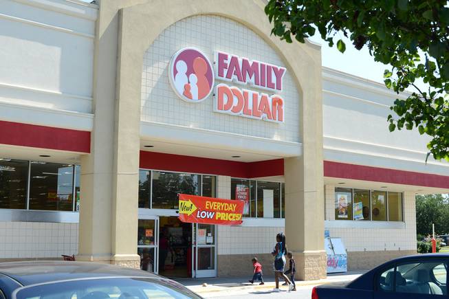 In this Tuesday, July 29, 2014, photo, customers enter a Family Dollar store on Plaza Boulevard in Kinston, N.C. There’s now a bidding war for Family Dollar, with Dollar General offering about $9.7 billion for the discounter in an effort to trump Dollar Tree’s bid of $8.5 billion.