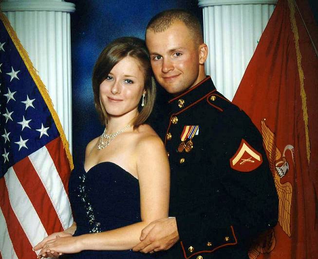 This undated file photo shows Erin Corwin, left, with her husband, Jonathan Wayne Corwin, a corporal in the U.S. Marine Corps. Erin Corwin disappeared after leaving her home on the Twentynine Palms Marine Corps base June 28, 2014. 