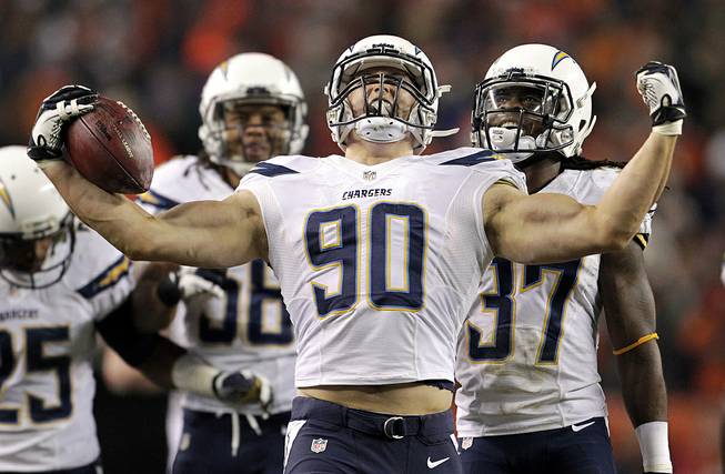 In this Thursday, Dec. 12, 2013, file photo, San Diego Chargers linebacker Thomas Keiser celebrates after intercepting a pass by Denver Broncos quarterback Peyton Manning in the fourth quarter of an NFL football game in Denver. 
