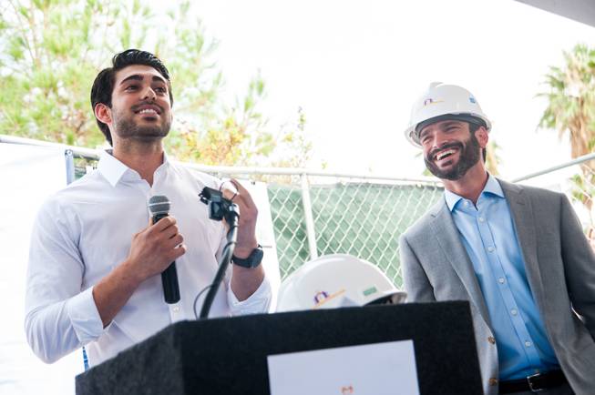 Guiseppe Pizano (left), a former homeless youth and NPHY beneficiary, shares his story of homelessness and how he received assistance through NPHY while Arash Ghafoori, NPHY executive director, listens.  Pizano subsequently graduated from high school and is now attending college and working.